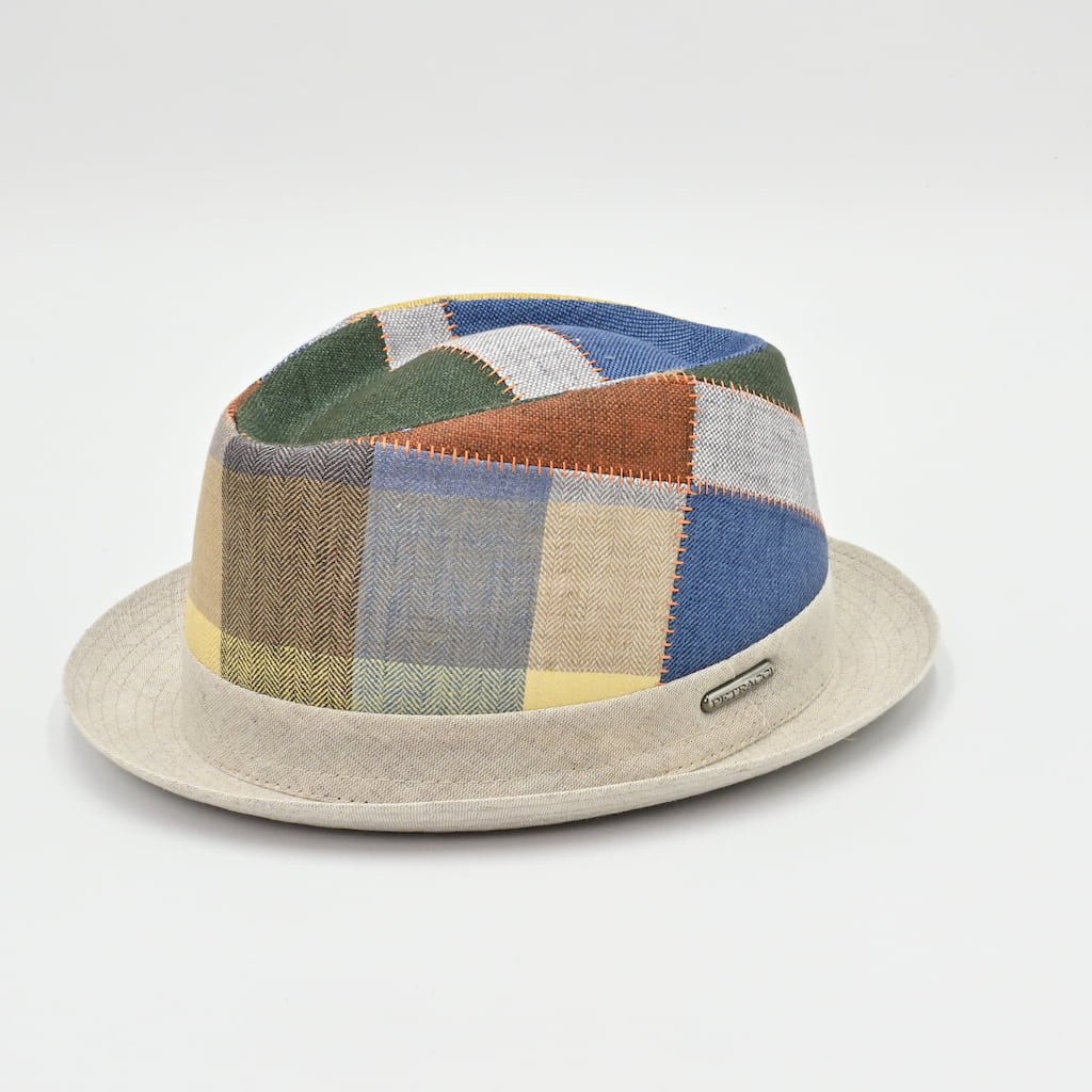 Patchwork hat with a beige base on a light gray background