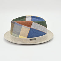 Patchwork hat with multicolor pattern on a light gray background