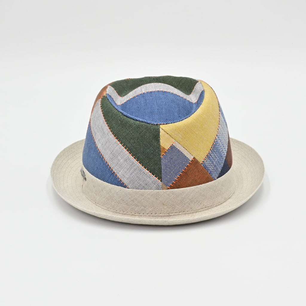 Colorful geometric-patterned hat on a light gray background
