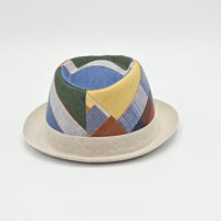 Colorful geometric-patterned hat on a light gray background