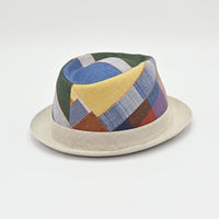 back view of Colorful patchwork hat on a light gray background