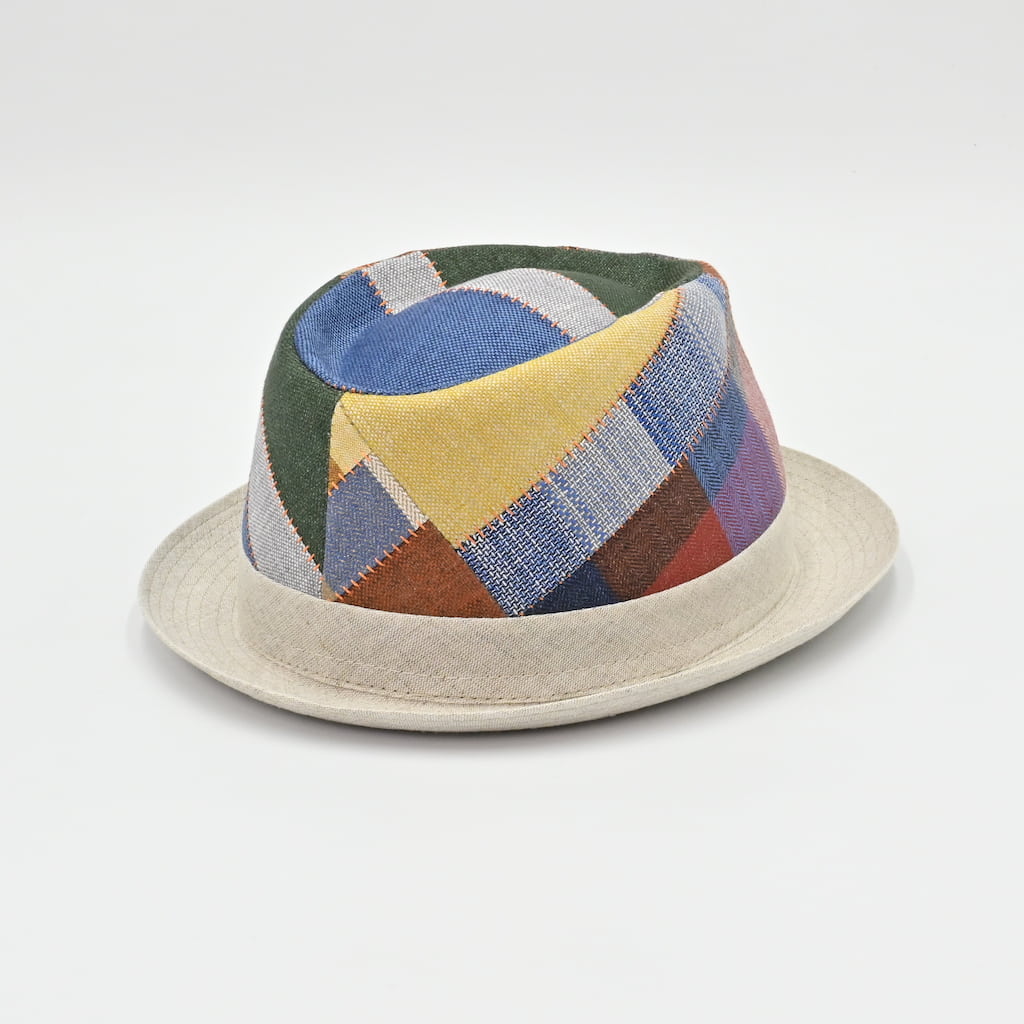 back view of Colorful patchwork hat on a light gray background