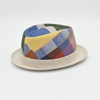 Side view of Patchwork hat with multicolored fabric on a light gray background