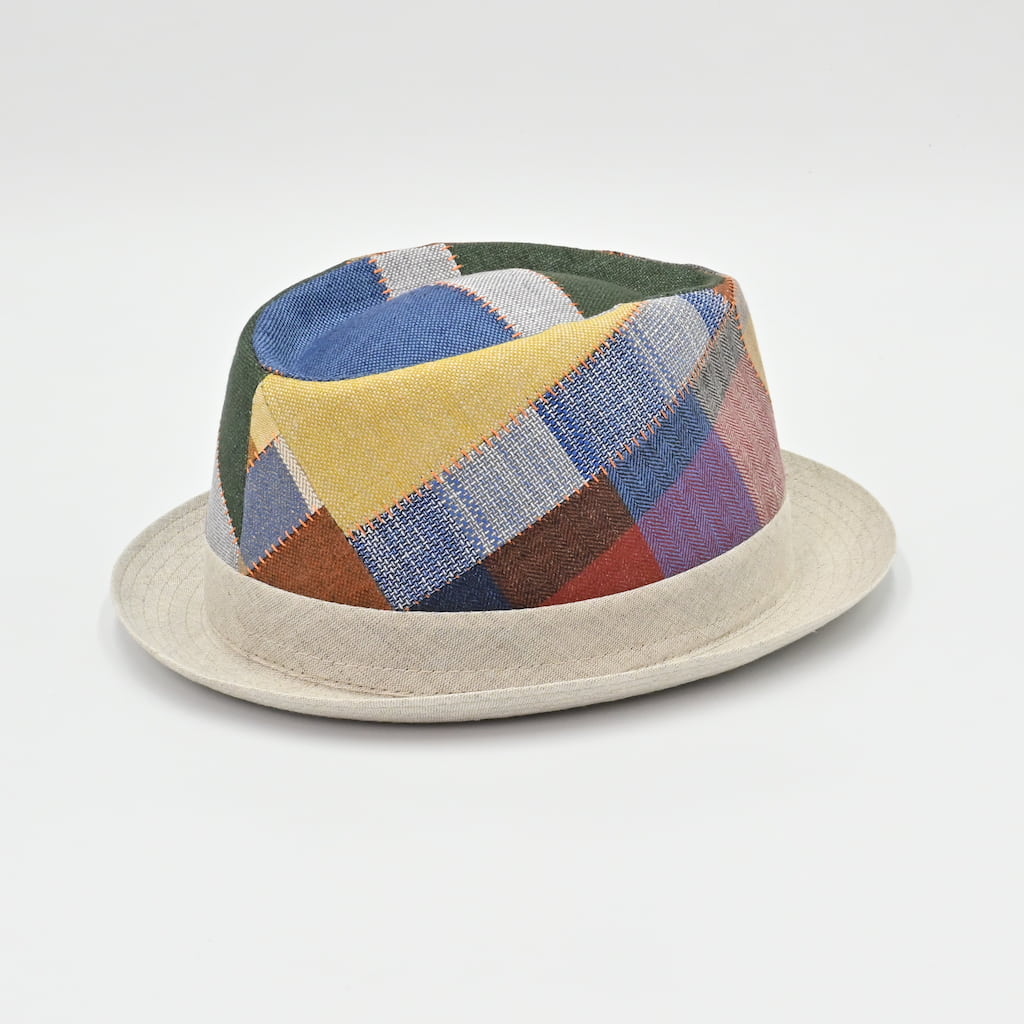 Side view of Patchwork hat with multicolored fabric on a light gray background