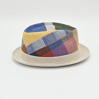 Multicolored patchwork hat on a light gray background