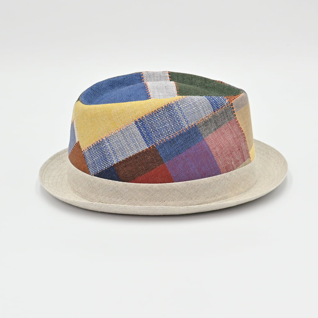 Multicolored patchwork hat on a light gray background
