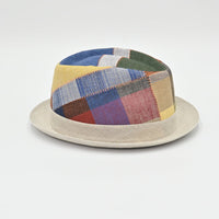 Side view of Patchwork hat with a colorful pattern on a light gray background