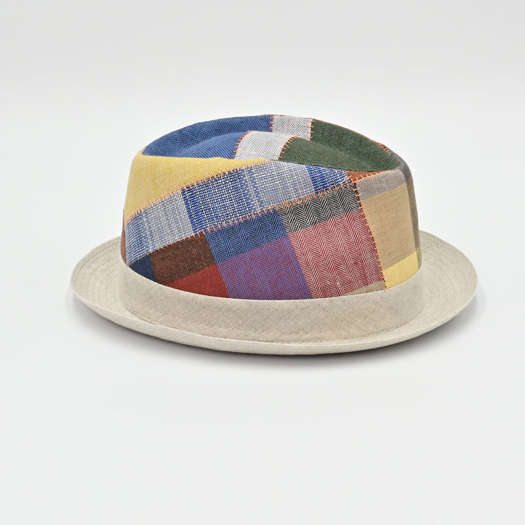 Side view of Patchwork hat with a colorful pattern on a light gray background