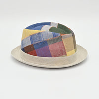 Multicolor patchwork hat on a light gray background