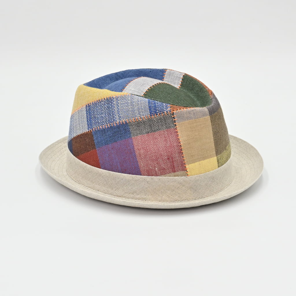 Multicolored patchwork hat on a light gray background