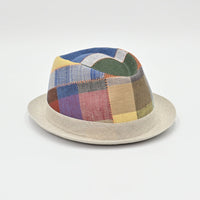 Multicolored patchwork hat on a light gray background