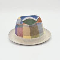Patchwork hat with multicolor pattern on a light gray background