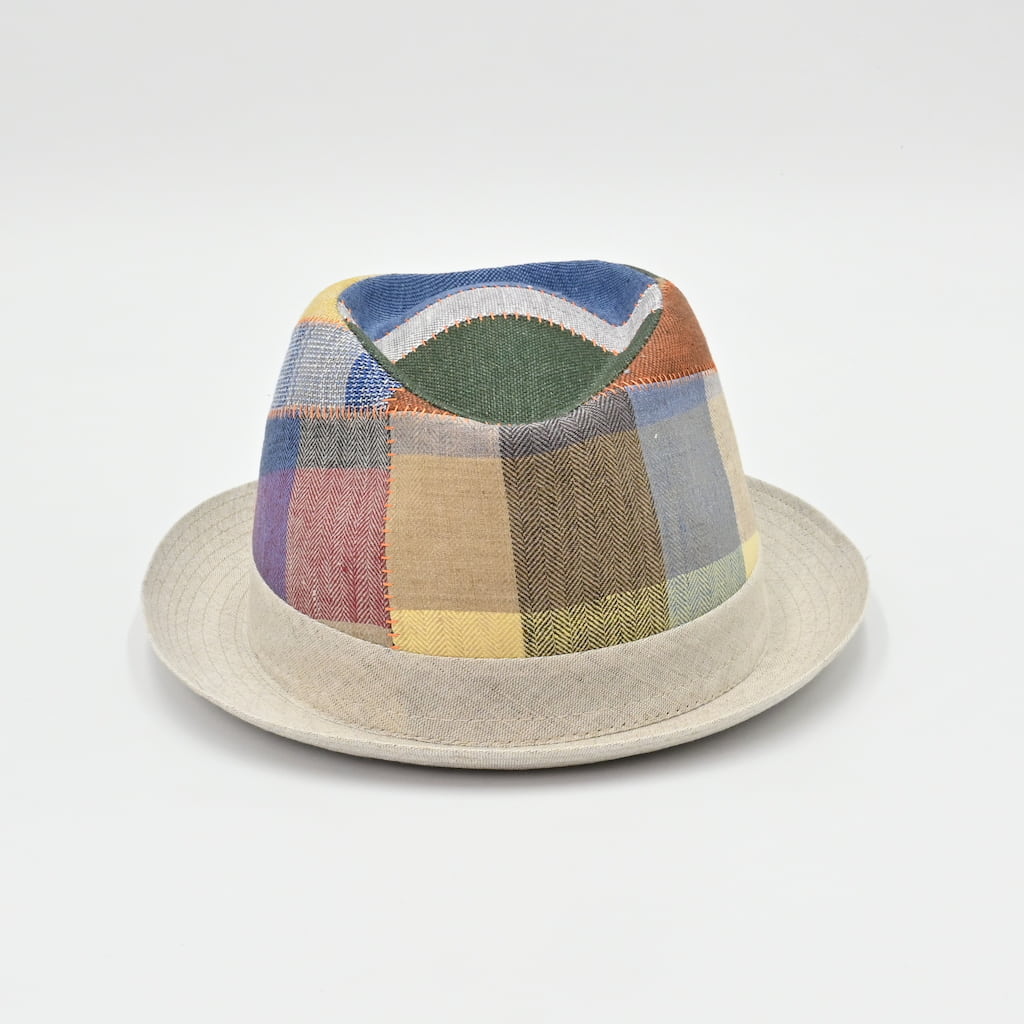 Patchwork hat with multicolor pattern on a light gray background