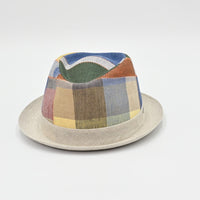 Patchwork hat with a colorful top and beige base on a light gray background
