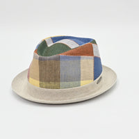 Patchwork-patterned hat on a light gray background