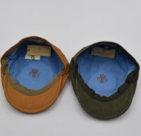 green and cognac leather newsboy hat inside view