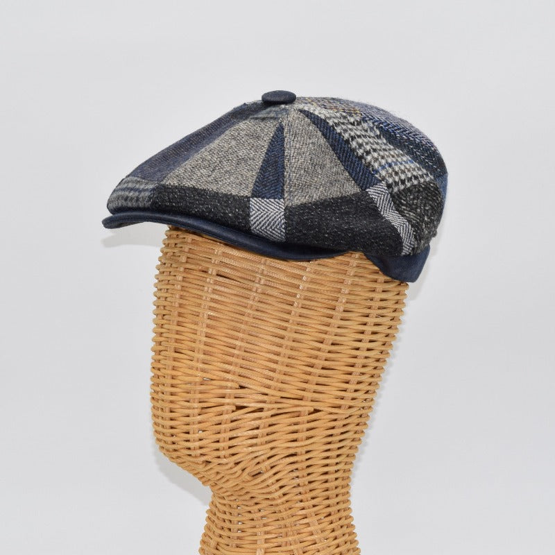 blue newsboy hat on mannequin