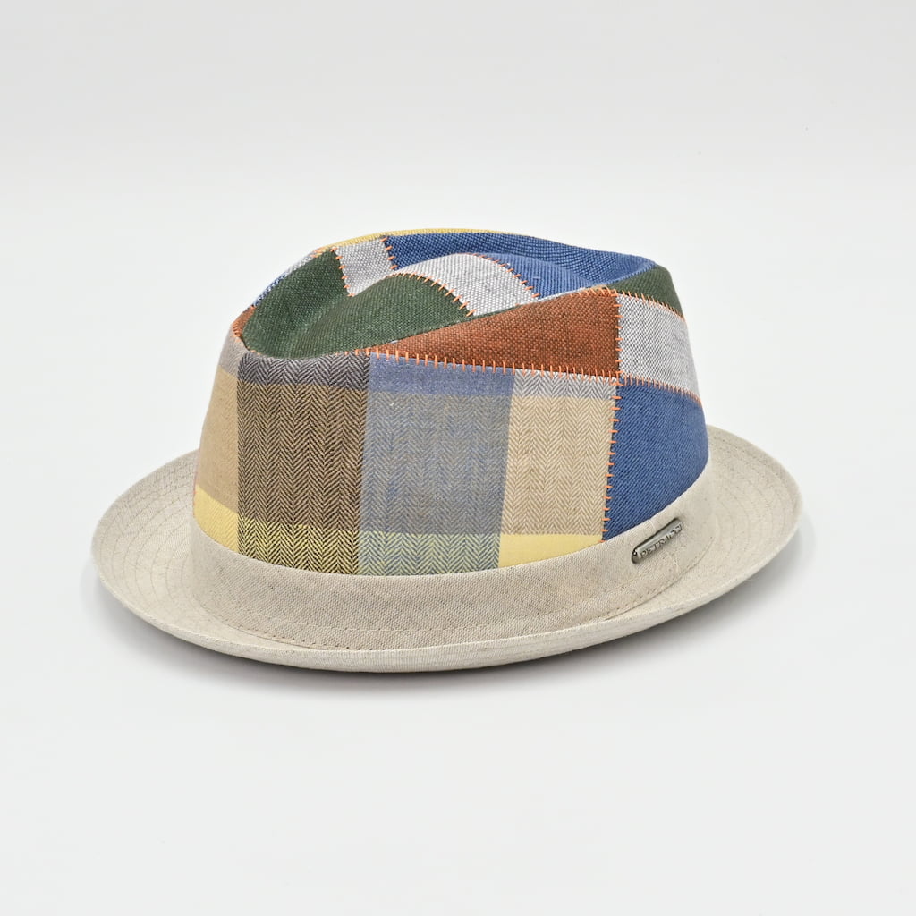 Front/side view of multicolor Patchwork hat with a beige base on a white background