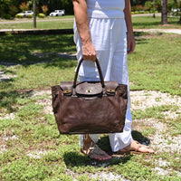 Brown Firenze Soft Leather Handbag side view with landscaping in the background