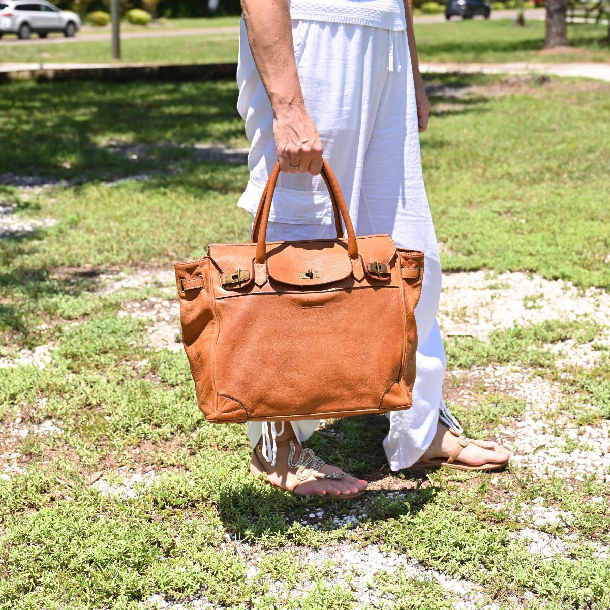 Cognac Firenze Soft Leather Handbag front view with landscaping in background