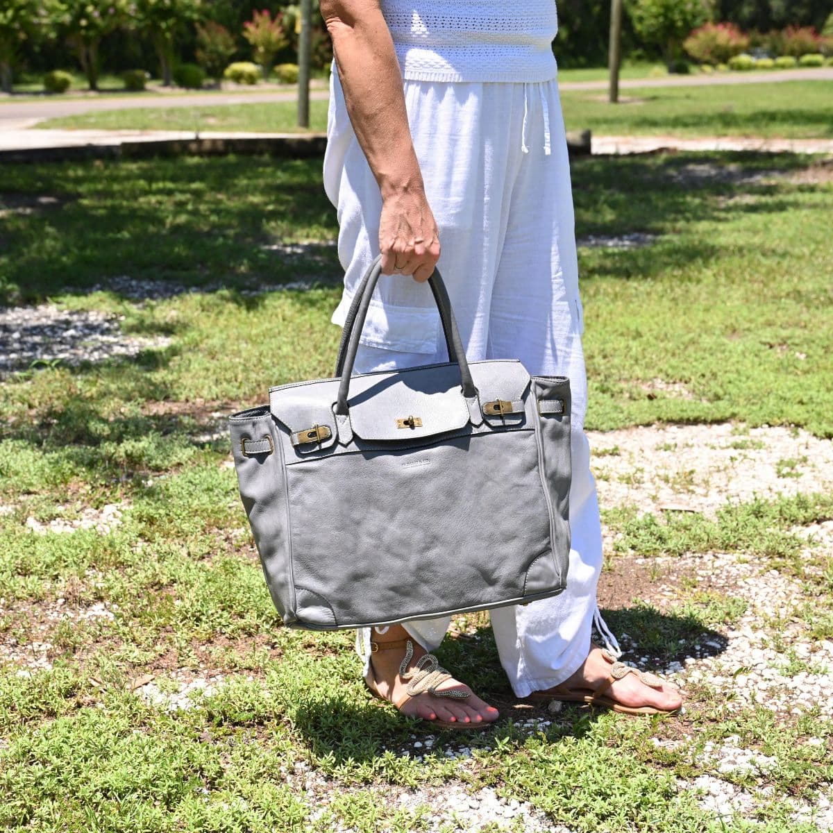 Grey Firenze Soft Leather Handbag front view with landscaping in background