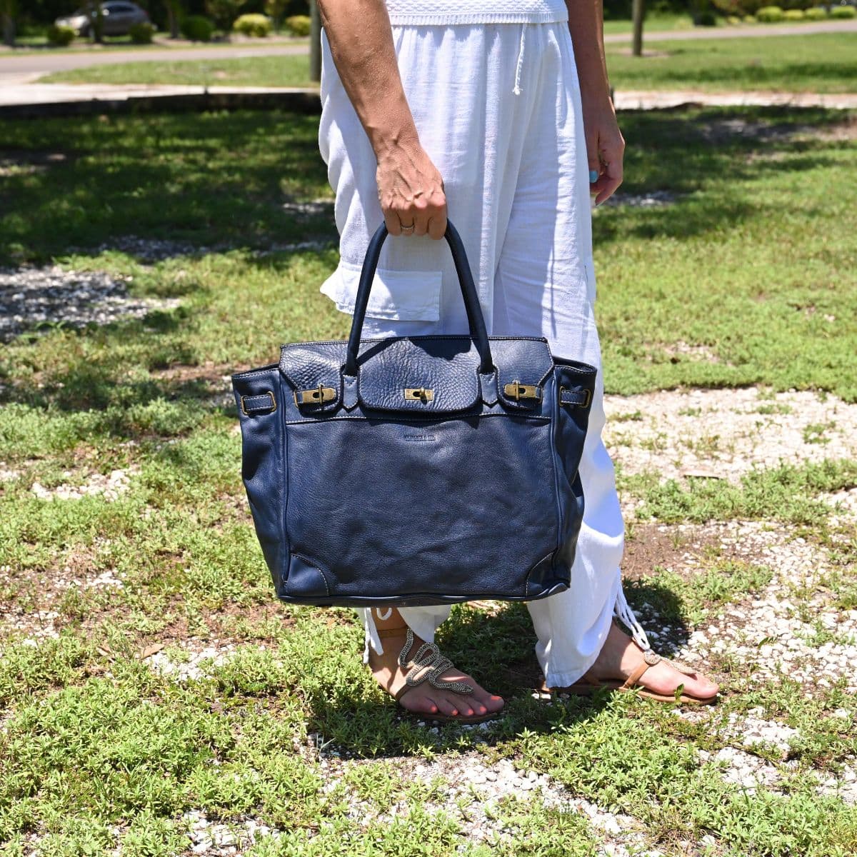 Blue Firenze Soft Leather Handbag front view with landscaping in background