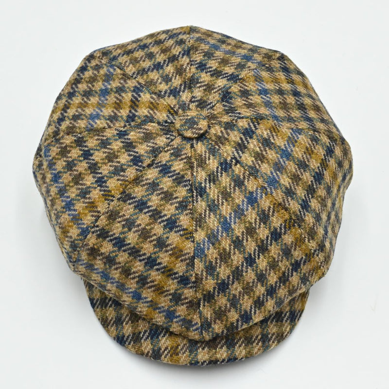 Top view of Fantasia Peaky Hat displaying the multicolor wool pattern and center button