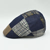 Side angle of multicolor wool and cotton Jeans Patchwork Cap featuring denim and woven patchwork panels