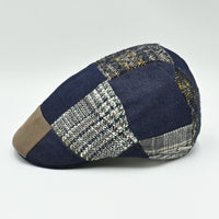 Side angle of multicolor wool and cotton Jeans Patchwork Cap featuring denim and woven patchwork panels