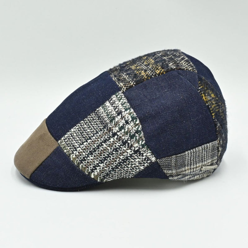 Side angle of multicolor wool and cotton Jeans Patchwork Cap featuring denim and woven patchwork panels