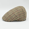 Side view of beige Pied de Poule wool cap in earth-tone pattern