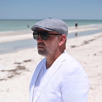 man in Blue Alfredo Newsboy Hat on the beach