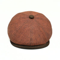 Rustico Linen Newsboy Hat with a button on a white background
