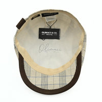 Beige Bartolomeo linen cotton newsboy hat with plaid pattern and leather visor on white background