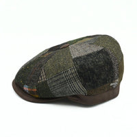 Brown Volterra Newsboy Patchwork Hat on white background. Cappello hat