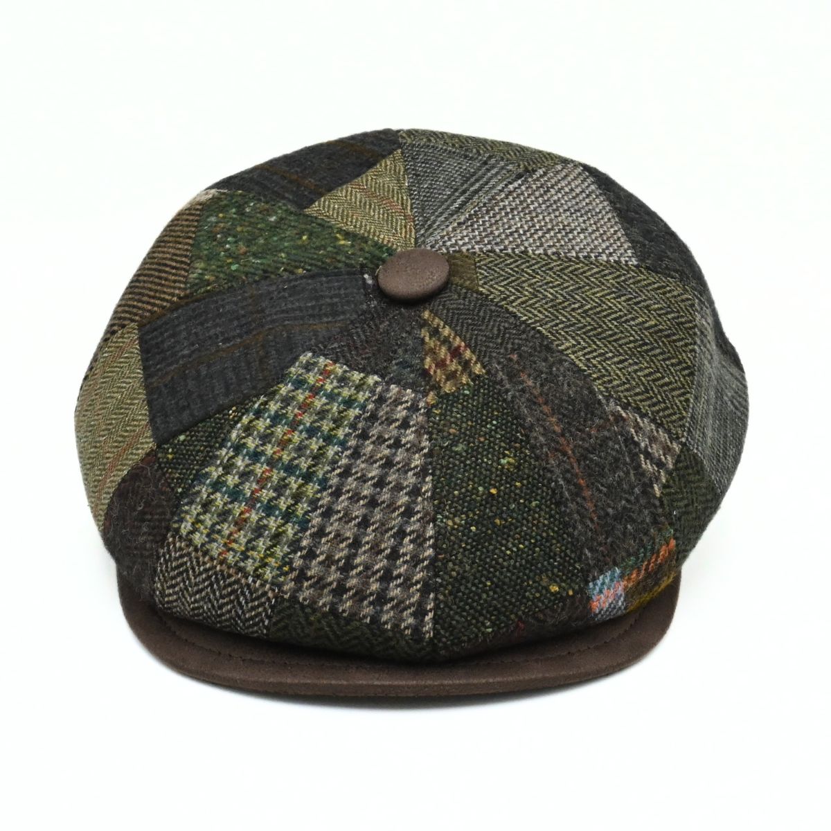 Brown Volterra Newsboy Patchwork Hat on white background. Cappello hat