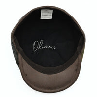 Brown Volterra Newsboy Patchwork Hat on white background. Cappello hat