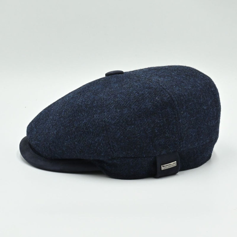 side view of navy Shetland Wool Leather-Trim Newsboy hat handmade in Italy – front view showing leather visor.