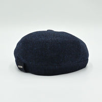 back view of navy Shetland Wool Leather-Trim Newsboy hat handmade in Italy – front view showing leather visor.