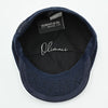 inside view of navy Shetland Wool Leather-Trim Newsboy hat handmade in Italy – front view showing leather visor.