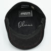 Black Modena Leather Newsboy Hat with red stitching interior view with white logo