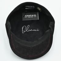 Black Modena Leather Newsboy Hat with red stitching interior view with white logo