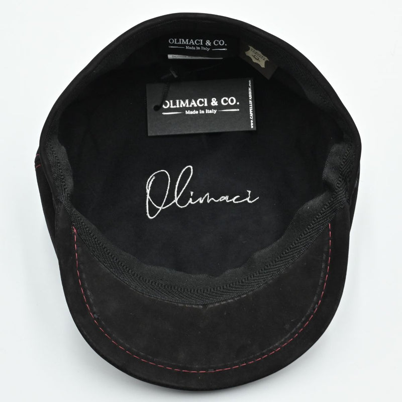 Black Modena Leather Newsboy Hat with red stitching interior view with white logo