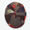 Top view of the Bordo Chianti Patchwork Newsboy Hat displaying the radial patchwork pattern and faux leather