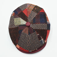 Top view of the Bordo Chianti Patchwork Newsboy Hat displaying the radial patchwork pattern and faux leather
