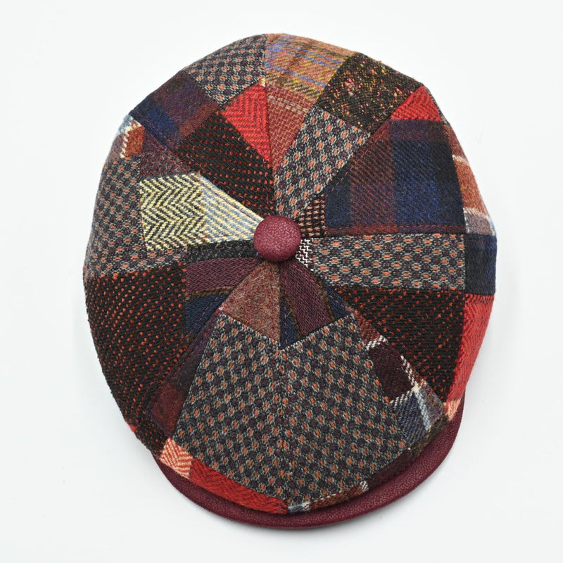 Top view of the Bordo Chianti Patchwork Newsboy Hat displaying the radial patchwork pattern and faux leather