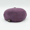 “Back view of lavender Shetland wool newsboy hat with Olimaci metal logo and leather tag – handmade in Italy.”