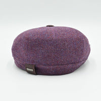 “Back view of lavender Shetland wool newsboy hat with Olimaci metal logo and leather tag – handmade in Italy.”