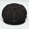 Black Modena Leather Newsboy Hat with red stitching top view