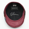 Inside view of the Chianti Bordo Patchwork Newsboy Hat showing the soft cotton lining for comfort